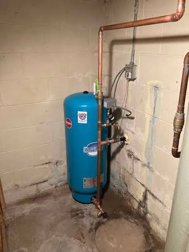 Replacement well pressure tank and pressure switch installed in a basement