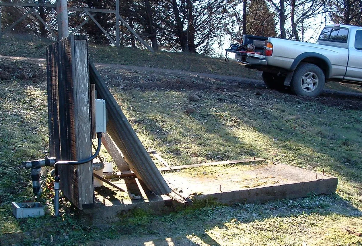 Submersible well pump pulled from a drilled bedrock well for repair